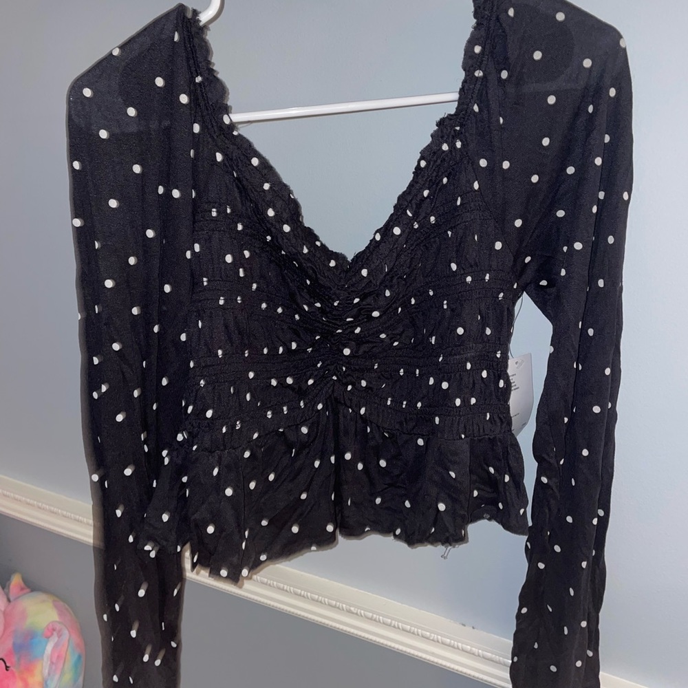 Smocked long sleeve polka dot top
